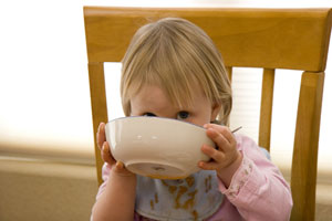 Child Drinking Soup
